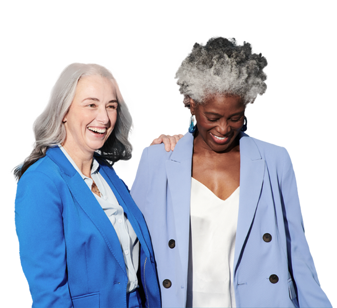 Two diverse women smiling and laughing in professional attire
